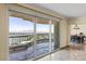 Floor-to-ceiling glass doors open to balcony with stunning views, adjacent to dining area at 2777 Paradise Rd # 2302, Las Vegas, NV 89109