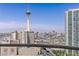 Panoramic city views of the Stratosphere from this private balcony, complemented by a clear blue sky at 2777 Paradise Rd # 2302, Las Vegas, NV 89109
