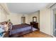Bedroom with accent dresser and a large window that provides light and city views at 2777 Paradise Rd # 2302, Las Vegas, NV 89109