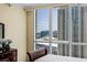 Bedroom view featuring hardwood floors, a city view, and plenty of sunlight at 2777 Paradise Rd # 2302, Las Vegas, NV 89109