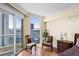 Bedroom with floor to ceiling windows providing city views and hardwood floors at 2777 Paradise Rd # 2302, Las Vegas, NV 89109