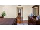 Elegant bedroom featuring hardwood floors, dark wood furniture, and a view into the bathroom at 2777 Paradise Rd # 2302, Las Vegas, NV 89109