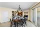 Dining room with modern chandelier, access to bar seating, and view to other rooms at 2777 Paradise Rd # 2302, Las Vegas, NV 89109
