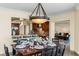 Cozy dining room with views to eat-in kitchen and living room is lit by a stylish chandelier at 2777 Paradise Rd # 2302, Las Vegas, NV 89109