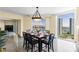This beautiful dining room is complete with modern lighting and stunning city views at 2777 Paradise Rd # 2302, Las Vegas, NV 89109