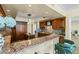 Gourmet kitchen featuring granite counters, custom cabinets, island, and high-end appliances at 2777 Paradise Rd # 2302, Las Vegas, NV 89109