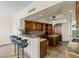Gourmet kitchen features granite counters, an island, stainless appliances, and custom wood cabinetry at 2777 Paradise Rd # 2302, Las Vegas, NV 89109
