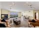 Spacious living room with comfortable seating, fireplace, and panoramic city views at 2777 Paradise Rd # 2302, Las Vegas, NV 89109