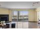 Bright living room with fireplace, floor-to-ceiling windows offering stunning city views at 2777 Paradise Rd # 2302, Las Vegas, NV 89109