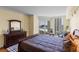 This is a warm main bedroom with wood floors and a plush area rug at 2777 Paradise Rd # 2302, Las Vegas, NV 89109