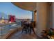 A balcony with a table and seating, showcasing expansive city views at 2877 Paradise Rd # 2602, Las Vegas, NV 89109