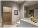 Well-lit bathroom features a walk-in shower and modern vanity at 2877 Paradise Rd # 2602, Las Vegas, NV 89109
