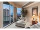Cozy bedroom with comfortable lounge, city views, and refined decor, perfect for relaxing and enjoying the scenery at 2877 Paradise Rd # 2602, Las Vegas, NV 89109