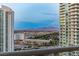 Elevated city view with buildings and mountains in the distance, capturing the beauty and breadth of the cityscape at 2877 Paradise Rd # 2602, Las Vegas, NV 89109