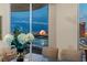 Dining room with glass table and balcony views of the Sphere and the Encore hotel at dusk at 2877 Paradise Rd # 2602, Las Vegas, NV 89109