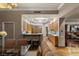 Open-concept dining area with modern lighting and wood flooring, next to the kitchen at 2877 Paradise Rd # 2602, Las Vegas, NV 89109