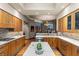 Spacious kitchen with marble countertops, custom cabinetry, stainless appliances, and modern lighting at 2877 Paradise Rd # 2602, Las Vegas, NV 89109