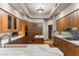 Modern kitchen features custom cabinets, marble counters, tile backsplash, and center island at 2877 Paradise Rd # 2602, Las Vegas, NV 89109
