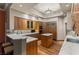 Gourmet kitchen with light wood cabinetry, stainless appliances, and marble countertops at 2877 Paradise Rd # 2602, Las Vegas, NV 89109