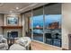 Cozy living room with a fireplace and expansive city views, creating a warm and inviting atmosphere at 2877 Paradise Rd # 2602, Las Vegas, NV 89109