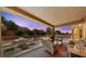 The covered patio offers a relaxing outdoor living space with comfortable seating and a serene ambiance at 2925 Lotus Hill Dr, Las Vegas, NV 89134