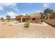 Expansive backyard with desert landscaping, covered patio, and seating area, perfect for relaxing at 2925 Lotus Hill Dr, Las Vegas, NV 89134