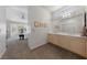 This bathroom has a double sink, a large mirror and views of the bedroom through an adjacent doorway at 2925 Lotus Hill Dr, Las Vegas, NV 89134