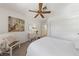 This bedroom has carpeted floor, a ceiling fan, white walls and trim and white furniture at 2925 Lotus Hill Dr, Las Vegas, NV 89134