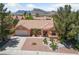 A charming single-story home boasting desert landscaping and beautiful mountain views in the background at 2925 Lotus Hill Dr, Las Vegas, NV 89134
