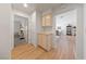 Inviting hallway with hardwood floors and convenient access to the bedroom and living areas at 2925 Lotus Hill Dr, Las Vegas, NV 89134