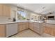 Well-lit kitchen featuring an open layout, plenty of counter space, and stainless steel appliances at 2925 Lotus Hill Dr, Las Vegas, NV 89134