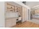 Cozy home office with built-in shelving, a modern desk, and seamless access to the kitchen at 2925 Lotus Hill Dr, Las Vegas, NV 89134