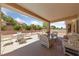 Inviting covered patio featuring wicker furniture and ample seating for outdoor entertaining at 2925 Lotus Hill Dr, Las Vegas, NV 89134