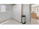 This storage room has white cabinets, tile floor and a window with blinds at 2925 Lotus Hill Dr, Las Vegas, NV 89134