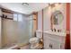 Stylish bathroom with glass shower, marble vanity, and decorative mirror at 3141 E Katie Ave, Las Vegas, NV 89121