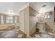 A bathroom with a marble tub, natural light and a separate vanity area with decorative fixtures at 3141 E Katie Ave, Las Vegas, NV 89121