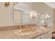 Granite countertop with a decorative sink and dual mirrors in a neutral toned bathroom at 3141 E Katie Ave, Las Vegas, NV 89121