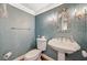Charming powder room with decorative mirror and wallpaper at 3141 E Katie Ave, Las Vegas, NV 89121