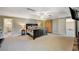 Expansive bedroom with neutral carpet, a ceiling fan, and an armoire at 3141 E Katie Ave, Las Vegas, NV 89121