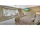 This sun-filled bedroom features a large window nook, neutral decor, and relaxing ambiance at 3141 E Katie Ave, Las Vegas, NV 89121