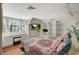 This bright bedroom features a built-in desk area, a large window, and built-in shelving at 3141 E Katie Ave, Las Vegas, NV 89121