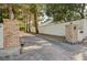 Long paved driveway leading to the home, framed by brick pillars and mature trees at 3141 E Katie Ave, Las Vegas, NV 89121