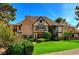 Charming two-story home features manicured lawn, brick accents, and Tudor-style details at 3141 E Katie Ave, Las Vegas, NV 89121