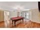 Bright game room features a pool table and glass doors to the backyard at 3141 E Katie Ave, Las Vegas, NV 89121