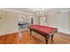 Open game room with pool table and view to another room at 3141 E Katie Ave, Las Vegas, NV 89121