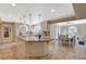 Spacious kitchen with large island, granite countertops, and open access to the dining area at 3141 E Katie Ave, Las Vegas, NV 89121