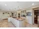 Open kitchen boasts an island with cooktop, double ovens, and ample counter space at 3141 E Katie Ave, Las Vegas, NV 89121