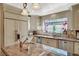 Well-lit kitchen featuring granite countertops, stainless steel appliances, and custom cabinetry at 3141 E Katie Ave, Las Vegas, NV 89121