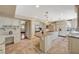 Bright, open kitchen features a large center island with granite countertops and custom cabinetry at 3141 E Katie Ave, Las Vegas, NV 89121