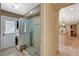 Convenient laundry area with stackable washer/dryer and a glass-enclosed shower at 3141 E Katie Ave, Las Vegas, NV 89121